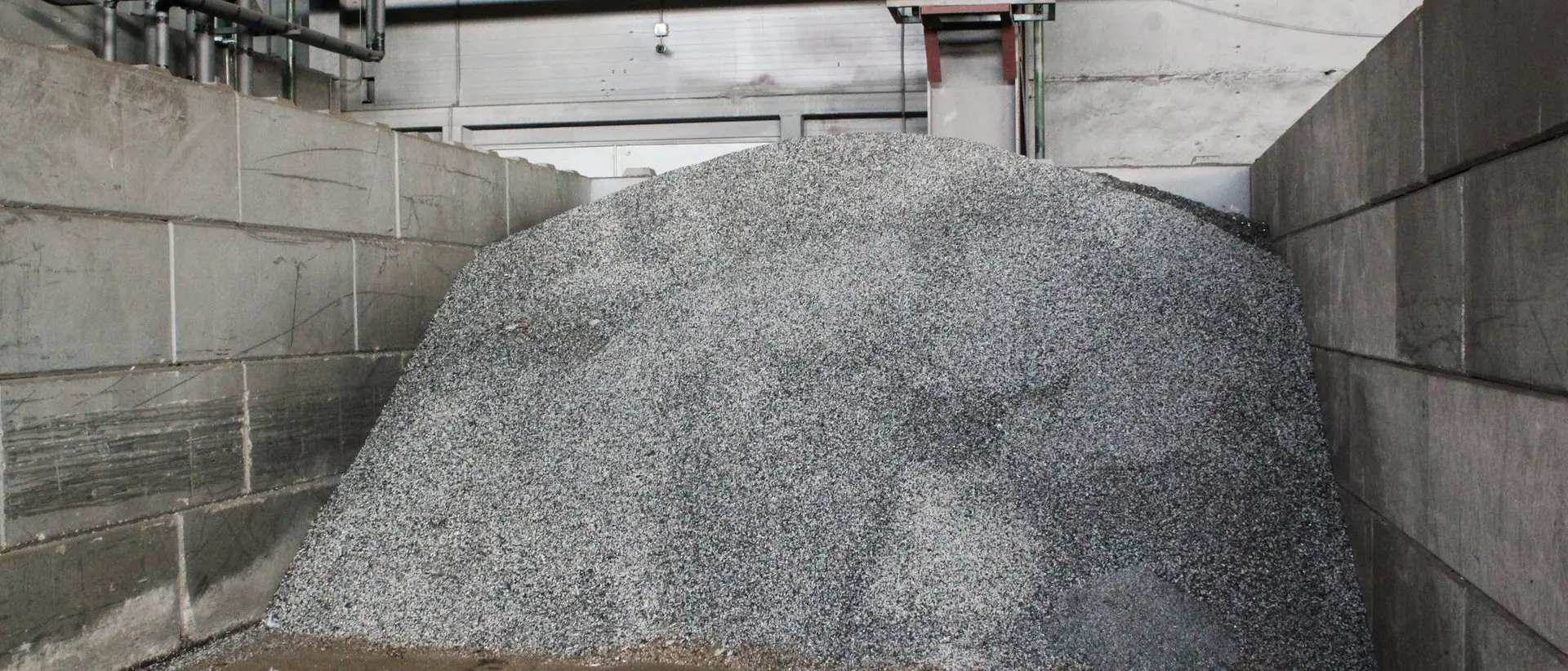 Processed crushed aggregate stored in a bunker bay