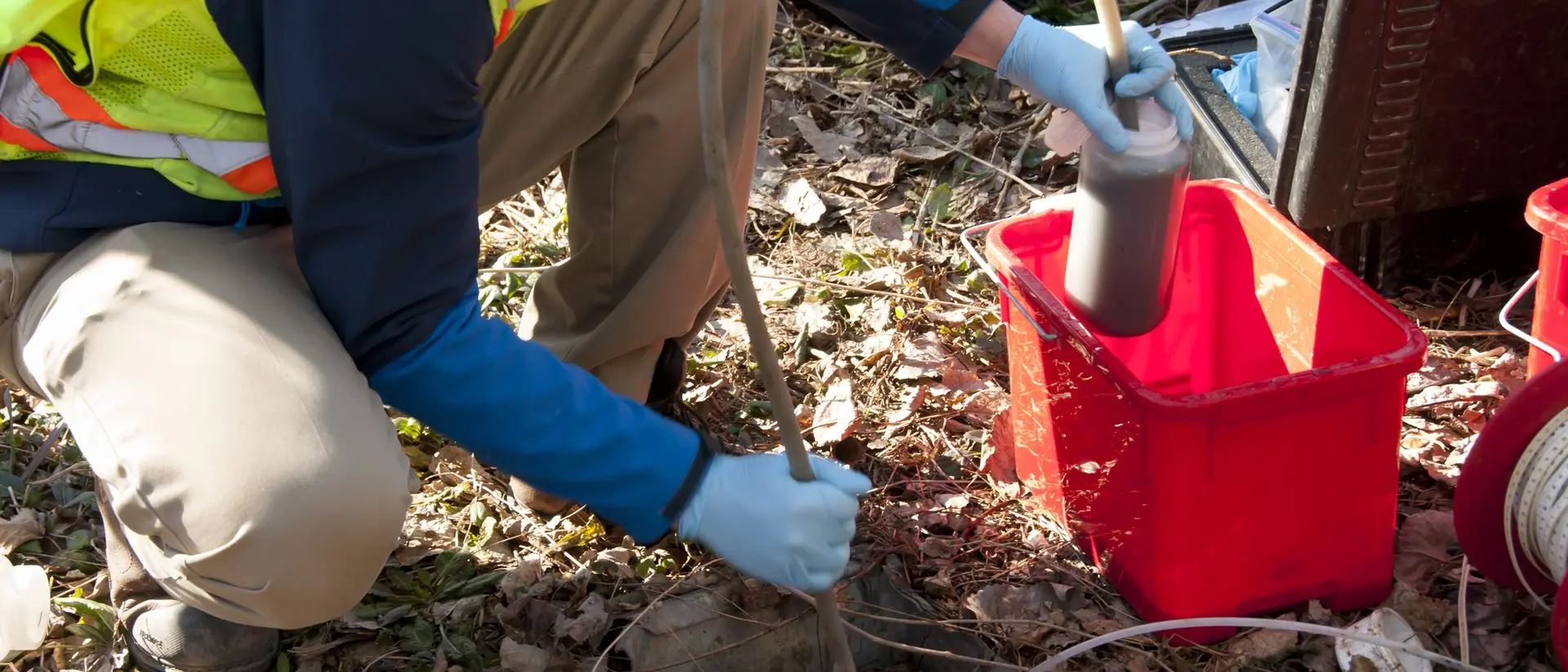 Environmental technician collecting a groundwater sample