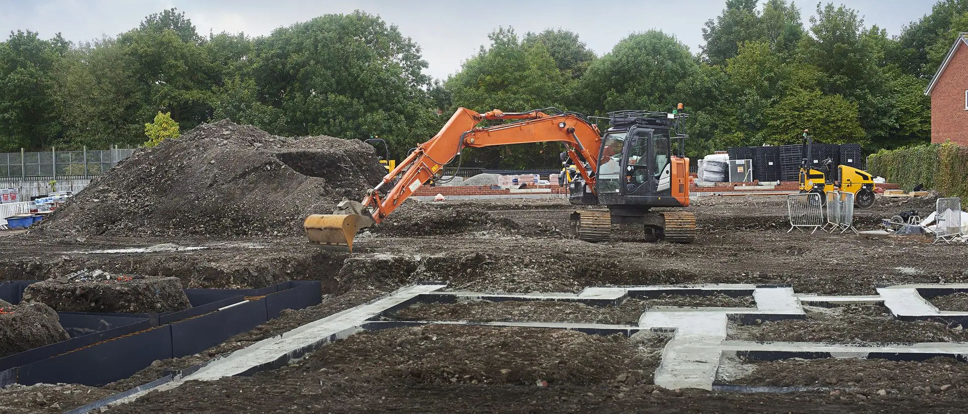 Excavator working bulk earthworks on a construction site