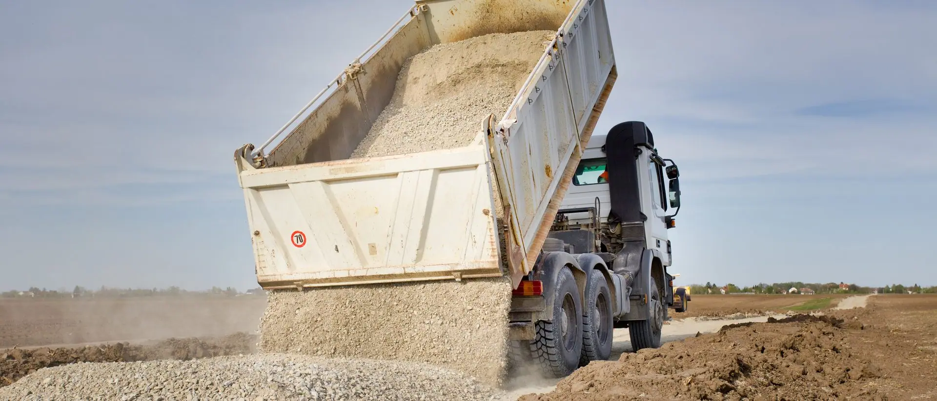 Truck discharging a load of aggregate